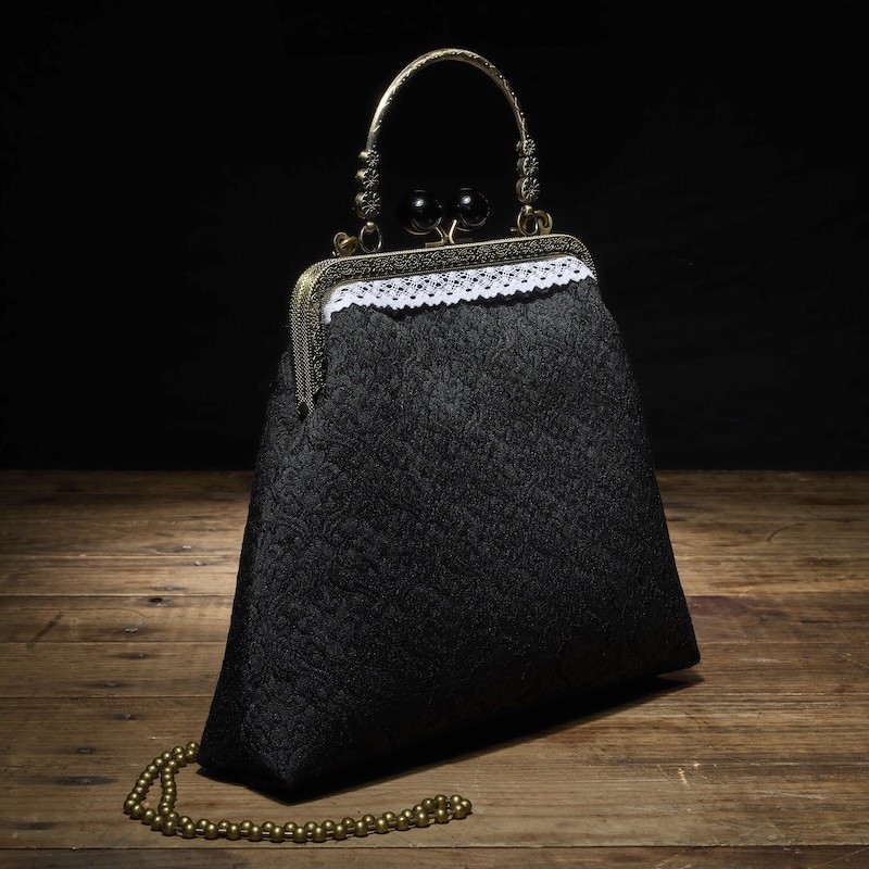 Bolso con cierre de boquilla y asa Vintage